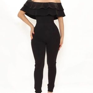 Black Jumpsuit, tight fit, stretchy, very comfortable material, has a ruffle top